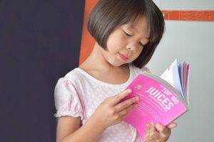 Asian Girl Reading Book